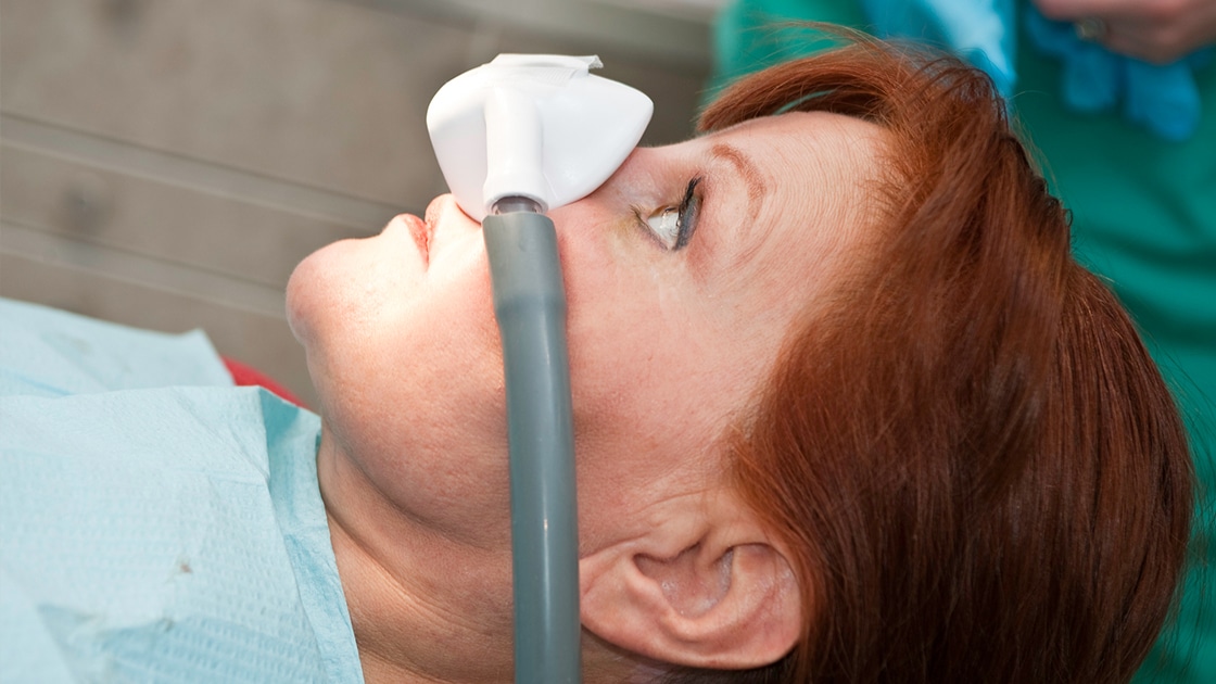 lady in dental chair ready for sedation